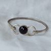 pulsera cabujón de azabache montada en infinito
